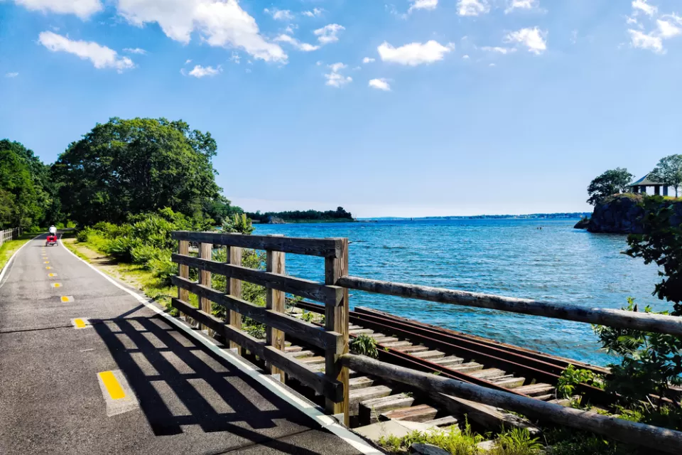 The East Bay Bike Lane runs along the water in Rhode Island.